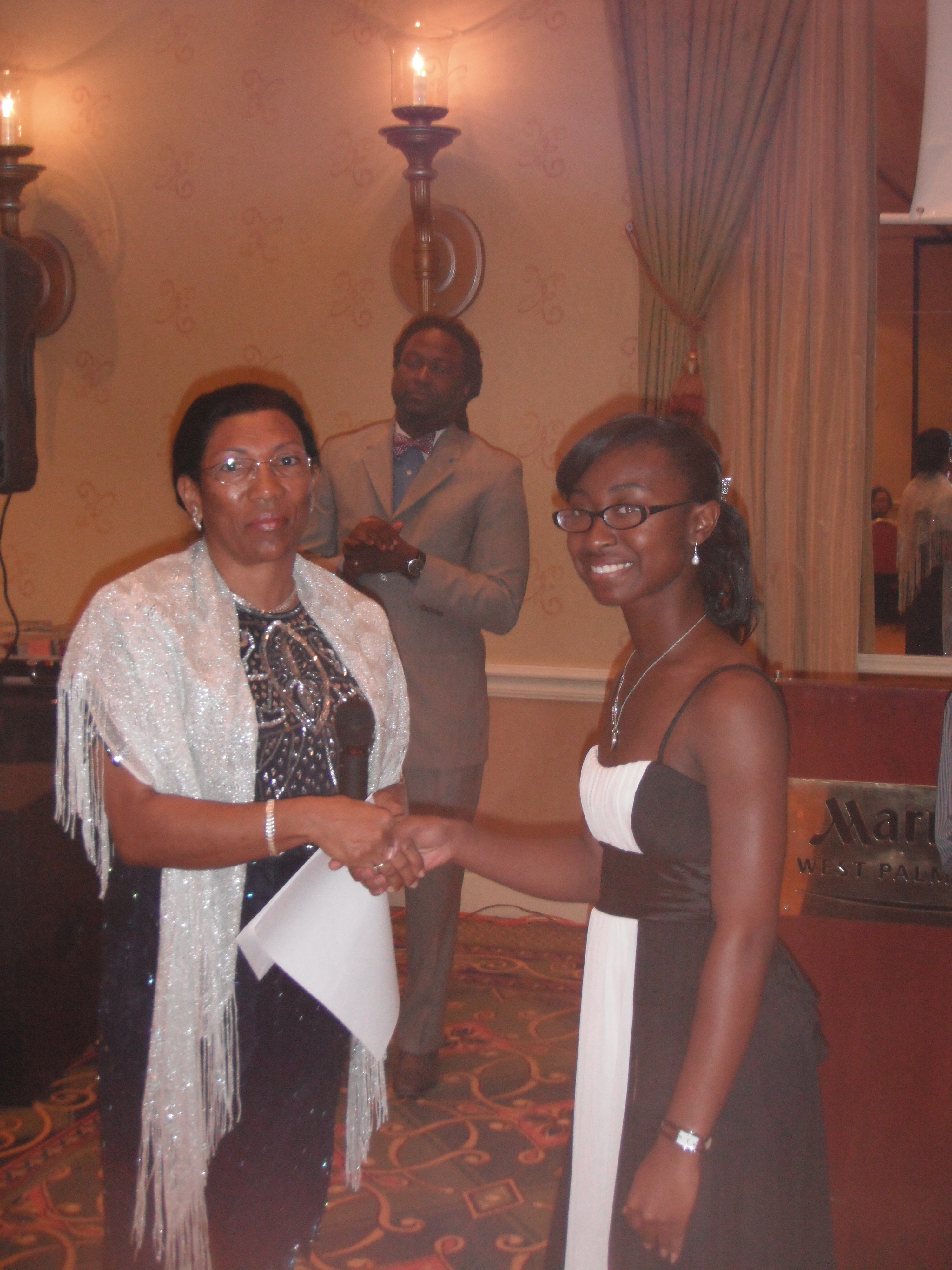 10 Scholarship Recipient with Presenter at Caribbean Educators Association Annual Scholarship Awards 2012