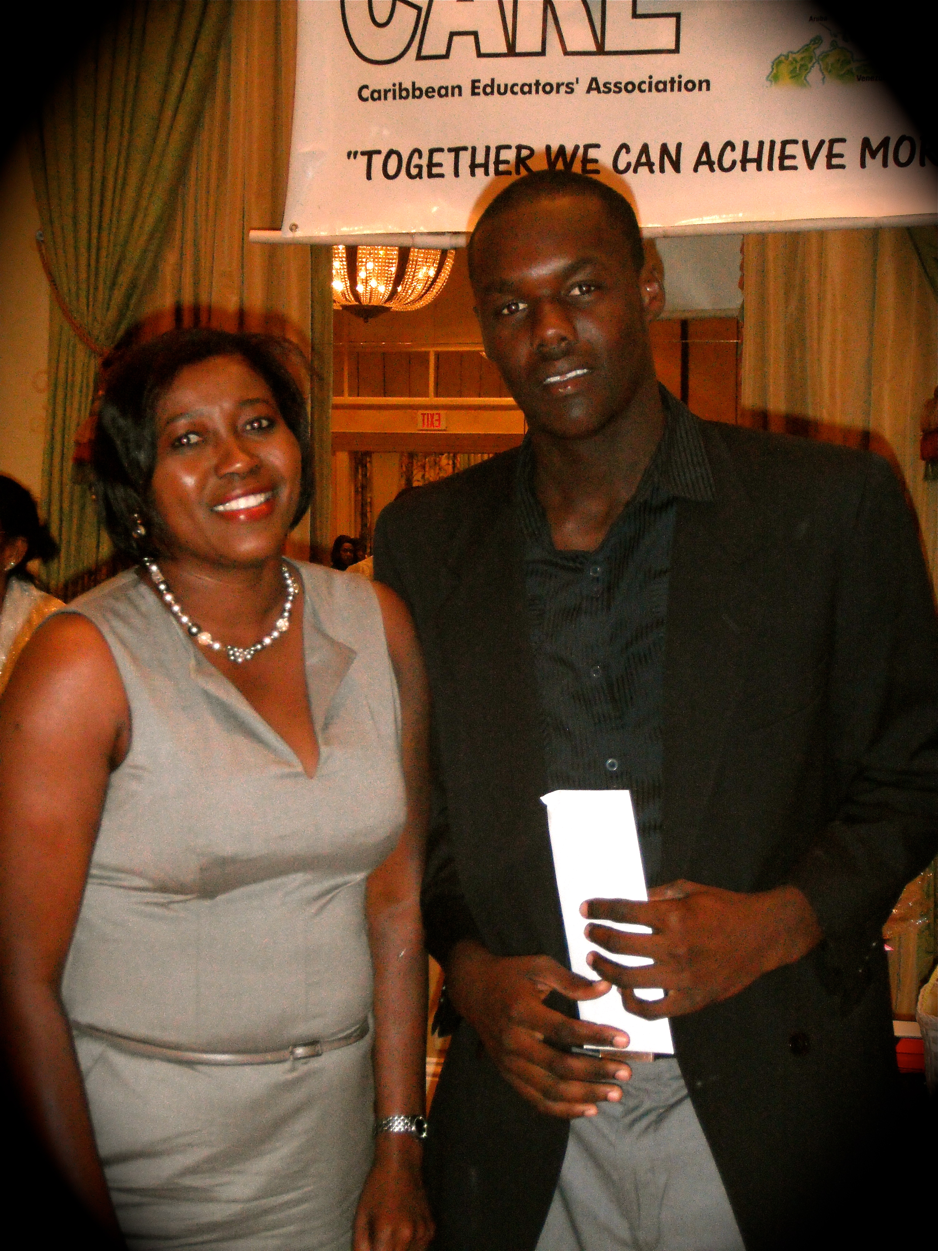 7 Scholarship Recipient with Presenter at Caribbean Educators Association Annual Scholarship Awards 2012