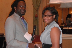 8 Scholarship Recipient with Presenter at Caribbean Educators Association Annual Scholarship Awards 2012